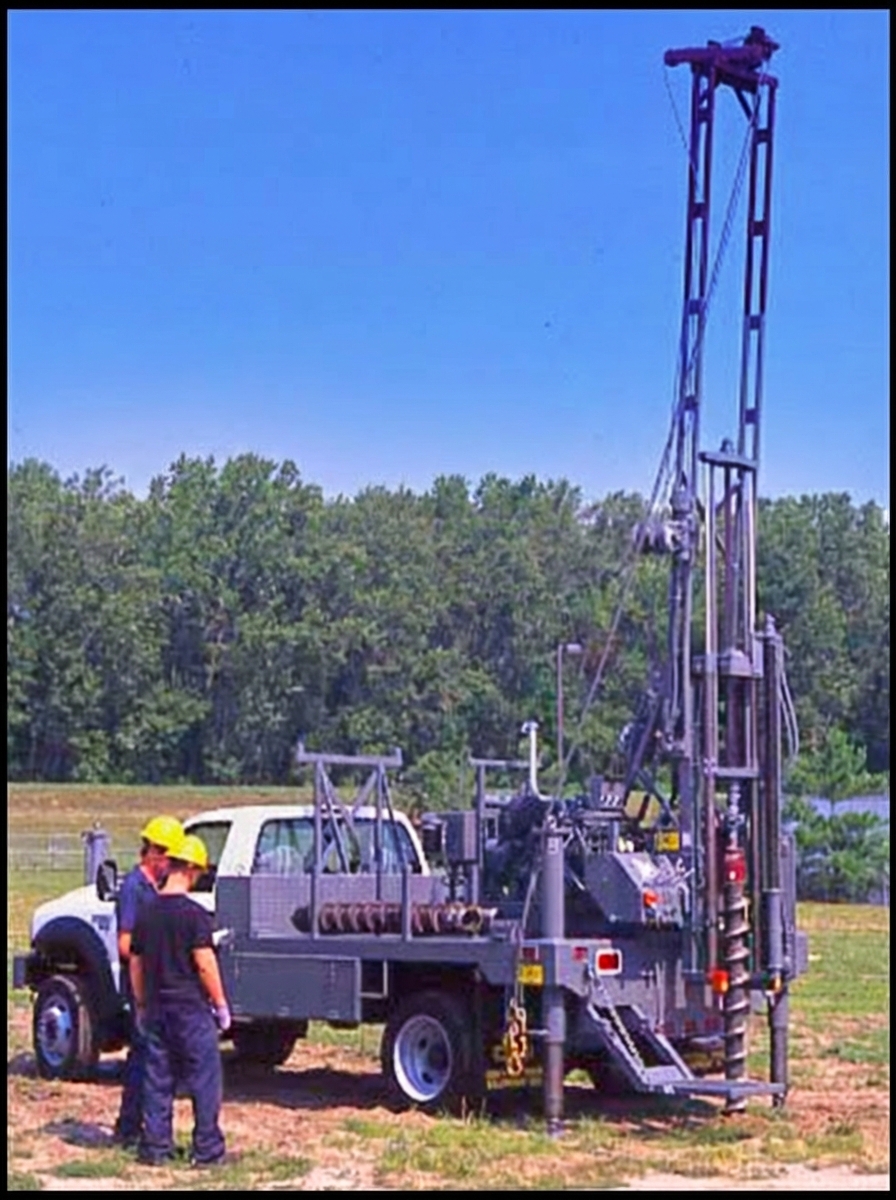 CME-45B truck-mounted auger drill with workers operating in an outdoor field setting